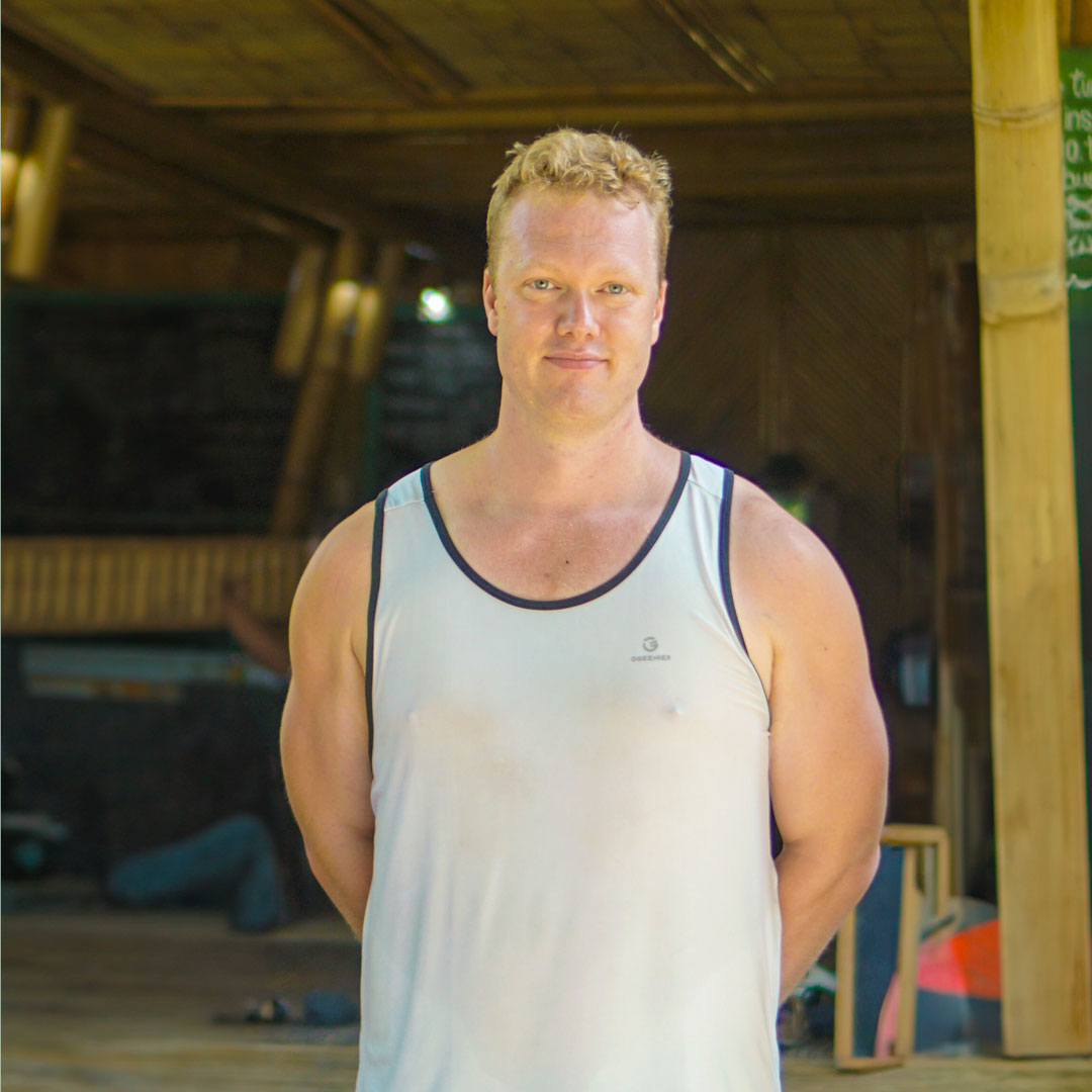 Yoga Teacher Training graduate at Power of Now Oasis in Bali standing in bamboo shala for review portrait